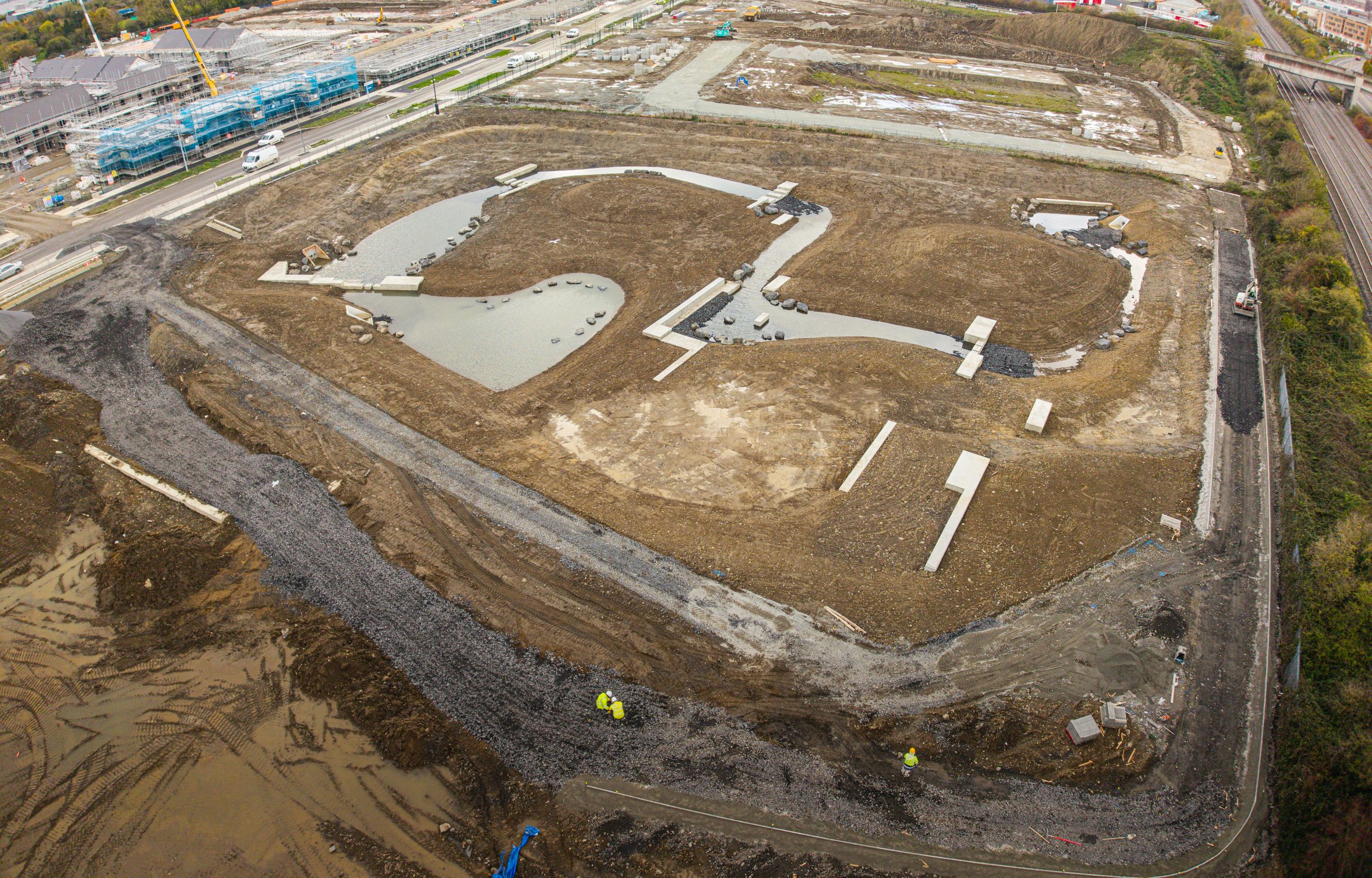 Aerial view of shaped landscape contours and planting at the development site in May 2025